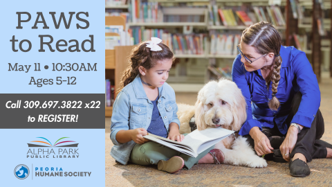 photo of little girl reading a book to a large white fluffy dog and a woman in a library