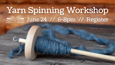 photo of wooden drop spindle wrapped with blue wool yarn laying on wooden table, white text