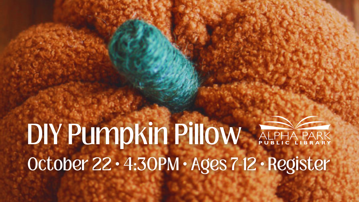 photograph of orange pumpkin pillow craft with white text