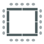 Tables forming a square with chairs surrounding the outer perimeter of the tables. The middle is an open space.